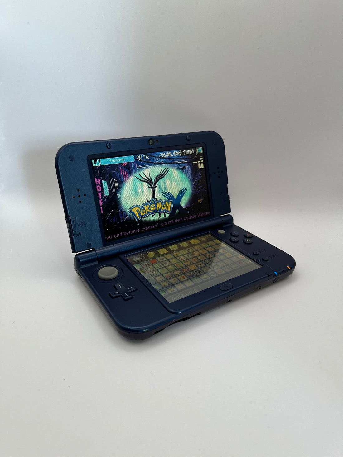 ReCollected New Nintendo 3DS XL Galaxy edition handheld console with a dual-screen display showing Pokemon X game