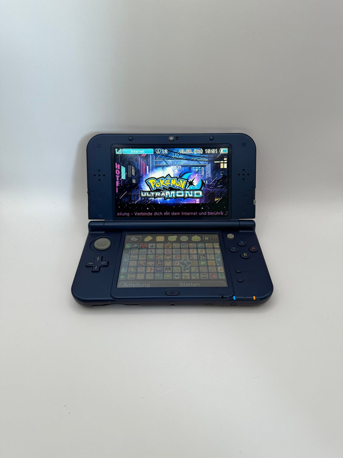 ReCollected New Nintendo 3DS XL Galaxy edition handheld console with Pokemon Ultra Moon game displayed on screen